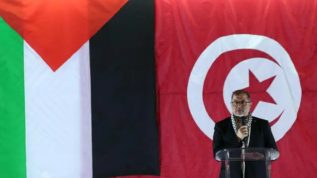 epa11073703 Member of the Hamas political bureau Basem Naim speaks during the Tunisian Forum to Support the Palestinian Resistance conference in Tunis, Tunisia, 13 January 2024. The forum is organized by the Tunisian Popular Movement. EPA/MOHAMED MESSARA