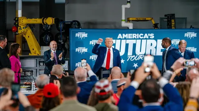 epa11667798 US Republican presidential candidate Donald J. Trump (C) raises his fist for the crowd at the end of a roundtable with community members hosted by the group 'Building America's Future' at Engineering Design Services Inc. in Auburn Hills, Michigan, USA, 18 October 2024. EPA/NICK HAGEN