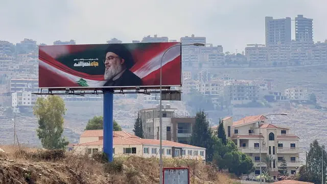 epa11645278 A billboard featuring a photo of late Hezbollah leader Hassan Nasrallah in the town of Jiyeh, some 23km south of Beirut, Lebanon, 06 October 2024. According to the Lebanese Health Ministry, at least two people were killed and 18 injured in an Israeli airstrike on Jiyeh on the night of 05 October 2024. Lebanese Minister of Health, Firas Abiad, announced on 05 October, that more than 2,000 people have been killed and more than 9,600 others have been injured in Lebanon since the beginning of the Hezbollah-Israeli conflict. EPA/STRINGER