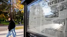 epa11669073 Two girls pass newspapers stands in downtown Chisinau, Moldova, 19 October 2024. Moldova will hold presidential elections on 20 October 2024. EPA/DUMITRU DORU