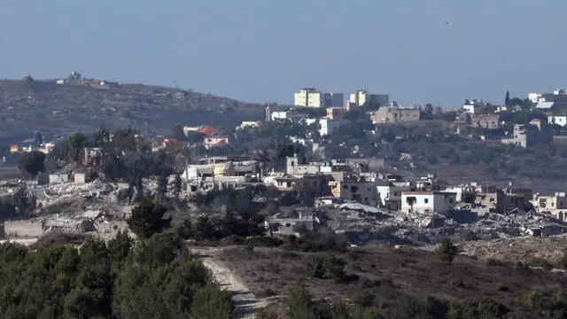 epa11649304 Destroyed buildings in Maroun El Ras village in southern Lebanon, as seen from the Israeli side of the border, northern Israel, 08 October 2024. The Israeli army reported that the 98th Division, including the Paratroopers Brigade, the Commando Brigade, the 7th Brigade and soldiers from the Yahalom Unit, are conducting limited targeted raids against Hezbollah strongholds near the border with Israel in southern Lebanon. EPA/ATEF SAFADI