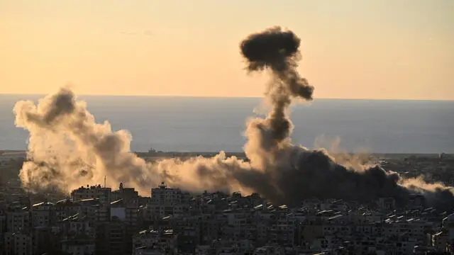 epa11669007 Smoke billows after an Israeli air strike on Dahieh, a southern suburb of Beirut, Lebanon, 19 October 2024. The Israeli army said the airstrikes were targeting Hezbollah weapons storage facilities. According to the Lebanese Ministry of Health, more than 2,400 people have been killed and over 11,200 others have been injured in Lebanon since the start of recent escalations of hostilities. EPA/STRINGER