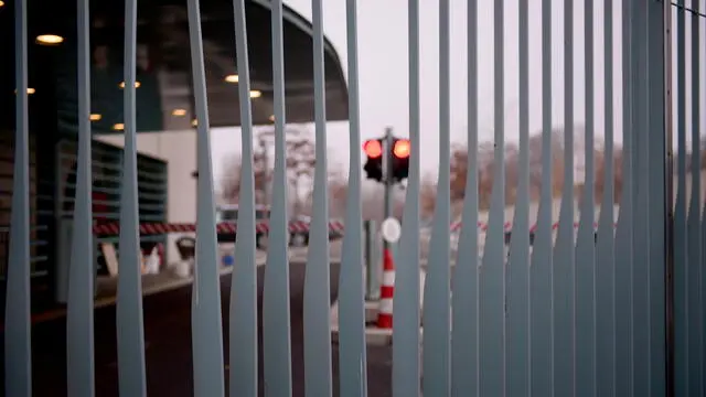 epa08840688 The slightly damaged gate to the chancellery after a car has crashed into it is seen in Berlin, Germany, 25 November 2020. According to a statement, the police are currently clarifying whether the driver hit the gate on purpose. He was taken into police custody. EPA/CLEMENS BILAN