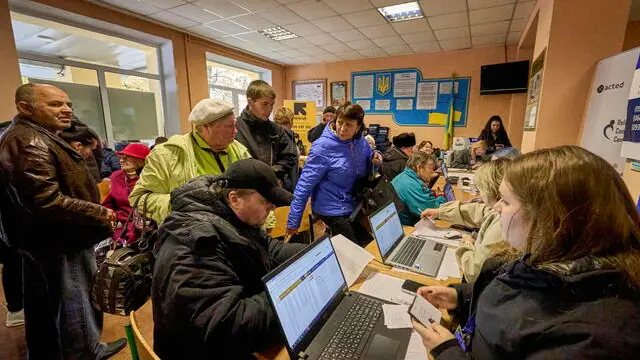 epa11664952 People who were evacuated from Kupyansk and other areas close to the frontline in the Kharkiv region, register as they arrive at an evacuation center in the city of Kharkiv, Ukraine, 17 October 2024, amid the Russian invasion. About 100 people were evacuated on 16 October, with around 250 more scheduled to be evacuated on 17 October. Since September 2024, almost 1,500 people have left Kupyansk, with about 2,500 more waiting to be evacuated, said the head of the Kharkiv Military Administration Oleg Synegubov. EPA/SERGEY KOZLOV