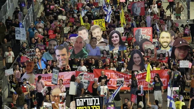 epa11653157 Families of Israeli hostages held by Hamas in Gaza and their supporters carry placards showing images of their loved ones during a protest calling for a ceasefire and for their release near the Kirya area, in Tel Aviv, Israel, 10 October 2024. According to the Israeli military, 101 Israeli hostages remain in captivity in the Gaza Strip. Rallies in Israel have been critical of the Israeli government's handling of the crisis, demanding the immediate release of all hostages. EPA/ABIR SULTAN