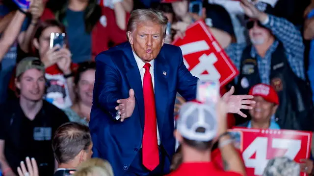 epa11676494 Former US president and Republican presidential nominee Donald Trump reacts at the conclusion of a campaign rally at the Greensboro Coliseum in Greensboro, North Carolina, USA, 22 October 2024. Trump is running against Democratic US Vice President Kamala Harris. EPA/ERIK S. LESSER