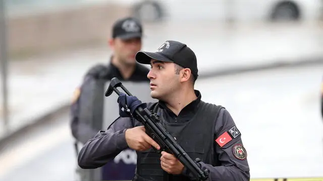 epa10893369 Turkish police officers secure the site of an attack near the Interior Ministry in Ankara, Turkey, 01 October 2023. According to the Turkish Minister of Interior Ali Yerlikaya, two police officers were injured when two people carried a bomb attack outside the ministry's gate, adding that one of the attackers blew himself up and the other was 'neutralized' by security forces. The ministry is located close to the Turkish parliament which was due to reopen on 01 October with a speech by Turkey's President Recep Tayyip Erdogan. EPA/NECATI SAVAS