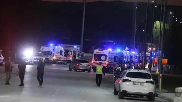 epa11677748 Ambulances arrive as policemen secure the area during a terror attack at (TUSAS) Turkish Aerospace and Aviation Center's headquearter in Ankara, Turkey 23 Ocober 2024. Turkish Interior Minister Ali Yerlikaya announced that four people were killed and 14 were injured in the terrorist attack. Two terrorists were also killed by security forces following an explosion at the headquarters of the Turkish aviation firm close to Ankara. EPA/NECATI SAVAS