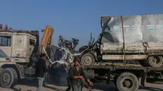 epa11677172 A destroyed truck that was used by workers of the United Nations Relief and Works Agency for Palestine Refugees (UNRWA) is loaded onto another truck after it was hit in an Israeli air strike on Salah Al Dine road between Deir Al Balah and Khan Younis town southern Gaza Strip, 23 October 2024. According to Palestinian officials and the Health Ministry in Gaza, two Palestinian workers of the United Nations Relief and Works Agency for Palestine Refugees (UNRWA) were killed after an Israeli air strike on 23 October. More than 42,600 Palestinians and over 1,400 Israelis have been killed, according to the Palestinian Health Ministry and the Israel Defense Forces (IDF), since Hamas militants launched an attack against Israel from the Gaza Strip on 07 October 2023, and the Israeli operations in Gaza and the West Bank which followed it. EPA/MOHAMMED SABER