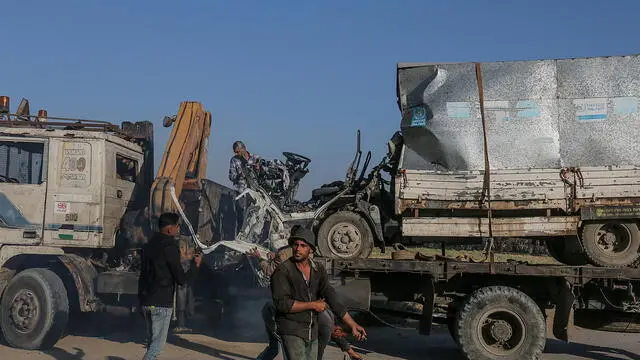 epa11677172 A destroyed truck that was used by workers of the United Nations Relief and Works Agency for Palestine Refugees (UNRWA) is loaded onto another truck after it was hit in an Israeli air strike on Salah Al Dine road between Deir Al Balah and Khan Younis town southern Gaza Strip, 23 October 2024. According to Palestinian officials and the Health Ministry in Gaza, two Palestinian workers of the United Nations Relief and Works Agency for Palestine Refugees (UNRWA) were killed after an Israeli air strike on 23 October. More than 42,600 Palestinians and over 1,400 Israelis have been killed, according to the Palestinian Health Ministry and the Israel Defense Forces (IDF), since Hamas militants launched an attack against Israel from the Gaza Strip on 07 October 2023, and the Israeli operations in Gaza and the West Bank which followed it. EPA/MOHAMMED SABER