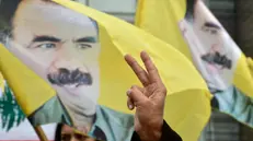 epa11147356 Supporters of Kurdistan Workers' Party (PKK) living in Lebanon carry banners, placards, national flags and pictures of PKK leader Abdullah Ocalan as they shout slogans on the 25th anniversary of his arrest, outside the United Nations Economic and Social Commission for Western Asia (UN-ESCWA) headquarters in Beirut, Lebanon, 12 February 2024. Tens of supporters of the PKK gather to demand the release of Abdullah Ocalan the jailed Kurdish leader of the Kurdistan Workers Party (PKK). EPA/WAEL HAMZEH