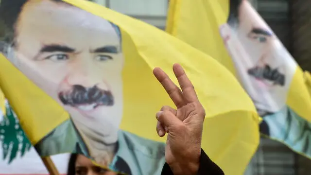 epa11147356 Supporters of Kurdistan Workers' Party (PKK) living in Lebanon carry banners, placards, national flags and pictures of PKK leader Abdullah Ocalan as they shout slogans on the 25th anniversary of his arrest, outside the United Nations Economic and Social Commission for Western Asia (UN-ESCWA) headquarters in Beirut, Lebanon, 12 February 2024. Tens of supporters of the PKK gather to demand the release of Abdullah Ocalan the jailed Kurdish leader of the Kurdistan Workers Party (PKK). EPA/WAEL HAMZEH