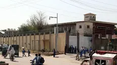 epa11637821 People pass by Adiyala prison where former PM Imran Khan, founder of opposition party Pakistan Tehrik-e-Insaf (PTI) is held, during his trial in Rawalpindi, Pakistan, 02 October 2024. The indictment proceedings in the Toshakhana Case 2 against former Prime Minister Imran Khan and his wife, Bushra Bibi, have been deferred until October 05. The hearing, held at Adiala Jail in Rawalpindi and presided over by Special Judge Central Shahrukh Arjumand, saw Khan request additional time to consult with his legal team, citing insufficient opportunity to prepare his defense. The Toshakhana case involves allegations that Khan improperly retained gifts received during his tenure as prime minister, which were supposed to be deposited in the state treasury. The postponement continues a series of legal challenges facing Khan amid ongoing political turmoil in Pakistan. EPA/SOHAIL SHAHZAD