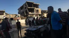 epa11650996 Palestinians inspect the site of an Israeli air strike on two civilian vehicles that killed at least six people in the Khan Younis refugee camp, southern Gaza Strip, 09 October, 2024. More than 42,000 PalestiniansÂ and over 1,400 Israelis have been killed, according to the Palestinian Health Ministry and the Israel Defense Forces (IDF), since Hamas militants launched an attack against Israel from the Gaza Strip on 07 October 2023, and the Israeli operations in Gaza and the West Bank that followed it. EPA/HAITHAM IMAD