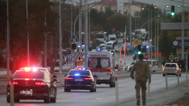 epa11677745 Ambulances arrive as policemen secure the area during a terror attack at (TUSAS) Turkish Aerospace and Aviation Center's headquearter in Ankara, Turkey 23 Ocober 2024. Turkish Interior Minister Ali Yerlikaya announced that four people were killed and 14 were injured in the terrorist attack. Two terrorists were also killed by security forces following an explosion at the headquarters of the Turkish aviation firm close to Ankara. EPA/NECATI SAVAS