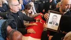 epa11680216 Relatives mourn before the coffin of Cengiz Coskun, one of the victims of a terror attack at the (TUSAS) Turkish Aerospace and Aviation Center headquarter the previous day, during his funeral ceremony in Ankara, Turkey, 24 October 2024. Turkish Interior Minister Ali Yerlikaya announced that five people were killed and 22 others were injured in the attack on 23 October. The minister also confirmed that two terrorists were killed by security forces following an explosion at the headquarters of the Turkish aviation firm close to Ankara. EPA/NECATI SAVAS