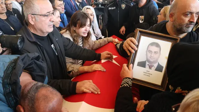 epa11680216 Relatives mourn before the coffin of Cengiz Coskun, one of the victims of a terror attack at the (TUSAS) Turkish Aerospace and Aviation Center headquarter the previous day, during his funeral ceremony in Ankara, Turkey, 24 October 2024. Turkish Interior Minister Ali Yerlikaya announced that five people were killed and 22 others were injured in the attack on 23 October. The minister also confirmed that two terrorists were killed by security forces following an explosion at the headquarters of the Turkish aviation firm close to Ankara. EPA/NECATI SAVAS