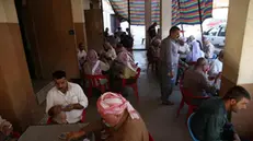 epa08582332 Yezidi men spend time in a tea house in Bahadre near Dohuk in the Kurdistan region, Iraq, 03 August 2020. The Kurdish northern Iraq is home to the Yazidi religious minority who was attacked and expelled by the Islamic State (IS) militia group in 2014. Hundreds of people were taken hostages then, including women used as sex slaves and as gifts between the militia fighters. EPA/Gailan Haji