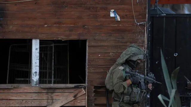 epa11018190 A photo taken while embedded with the Israel Defense Forces (IDF) shows an Israeli soldier taking position in the Palestinian town of Beit Lahia, on the outskirts of the city of Gaza, northern Gaza Strip, 08 December 2023. Israeli forces resumed military strikes on Gaza after a week-long truce expired on 01 December. More than 16,200 Palestinians and at least 1,200 Israelis have been killed, according to the Palestinian Health Ministry and the Israel Defense Forces (IDF), since Hamas militants launched an attack against Israel from the Gaza Strip on 07 October, and the Israeli operations in Gaza and the West Bank which followed it. The Israeli military stated that its forces are involved in 'ground operations' against Hamas in the Gaza Strip, including the south of the enclave. EPA/ATEF SAFADI