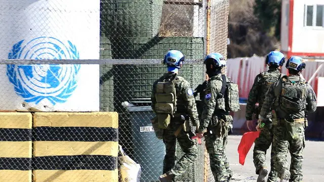 epa11680309 UNIFIL peacekeepers patrol near a Lebanese army checkpoint in Borj Rahal town, in the Tyre District, southern Lebanon, 24 October 2024. According to the Lebanese Ministry of Health, more than 2,500 people have been killed and over 12,000 others have been injured in Lebanon since the start of recent escalations of hostilities. EPA/STRINGER