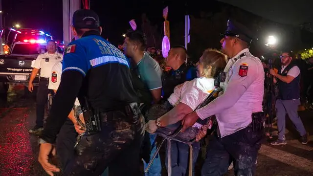 epa11362094 Paramedics evacuate one of the injured people after a stage collapsed at an election campaign rally in a suburb of Monterrey, capital of the northern Nuevo Leon state, Mexico, 22 May 2022 (issued 23 May 2024). At least nine people, including a child, were killed and more than 50 injured when a stage collapsed May 22 at an event where Mexican opposition Citizens' Movement Party presidential candidate Jorge Alvarez Maynez was campaigning, Nuevo Leon state governor Samuel Garcia said. EPA/MIGUEL SIERRA