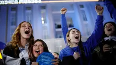 epaselect epa11685503 The Georgian Dream party supporters celebrate after exit poll results announcement in parliamentary elections at the Georgian Dream party headquarters in Tbilisi, Georgia, 26 October 2024. A total of 18 parties are participating in the parliamentary elections in Georgia. Three thousand, one hundred and eleven polling stations opened for the parliamentary elections, including 67 abroad. Voting abroad will be possible in 53 cities in 42 countries. EPA/DAVID MDZINARISHVILI