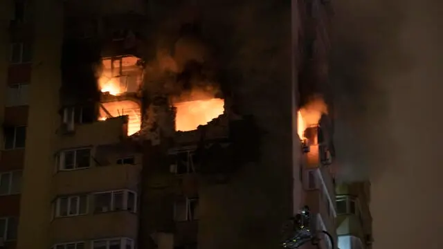 epa11683717 Ukrainian rescuers work at the site of a drone strike on a high-rise residential building in Kyiv, Ukraine, 25 October 2024, amid the Russian invasion. At least one person died and four others were injured according to the State Emergency Service. Russian troops entered Ukrainian territory on 24 February 2022, starting a conflict that has provoked destruction and a humanitarian crisis. EPA/MAXYM MARUSENKO