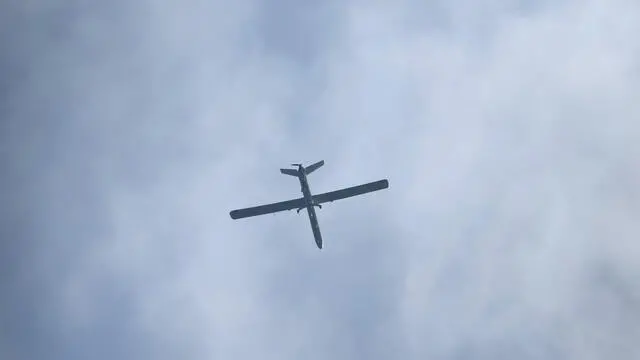 epa11043956 An Israeli drone flies over the Gaza Strip as seen from Be'eri next to the Israeli-Gaza border, Israel, 25 December 2023. More than 20,000 Palestinians and at least 1,300 Israelis have been killed, according to the Palestinian Health Ministry and the Israel Defense Forces (IDF), since Hamas militants launched an attack against Israel from the Gaza Strip on 07 October, and the Israeli operations in Gaza and the West Bank which followed it. EPA/ATEF SAFADI