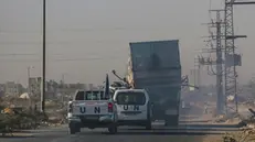 epa11677165 A destroyed truck that was used by workers of the United Nations Relief and Works Agency for Palestine Refugees (UNRWA) is loaded onto another truck after it was hit in an Israeli air strike on Salah Al Dine road between Deir Al Balah and Khan Younis town southern Gaza Strip, 23 October 2024. According to Palestinian officials and the Health Ministry in Gaza, two Palestinian workers of the United Nations Relief and Works Agency for Palestine Refugees (UNRWA) were killed after an Israeli air strike on 23 October. More than 42,600 Palestinians and over 1,400 Israelis have been killed, according to the Palestinian Health Ministry and the Israel Defense Forces (IDF), since Hamas militants launched an attack against Israel from the Gaza Strip on 07 October 2023, and the Israeli operations in Gaza and the West Bank which followed it. EPA/MOHAMMED SABER