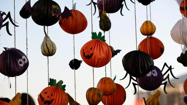 epa11685890 Halloween pumpkins made from paper are on display at the annual West Side Halloween Festival at Lake Mill Island in Bucharest, Romania, 26 October 2024. West Side Hallo Fest is the largest Halloween festival in Romania, held from 25 to 27 October, with approximately 100,000 visitors expected to attend. EPA/ROBERT GHEMENT
