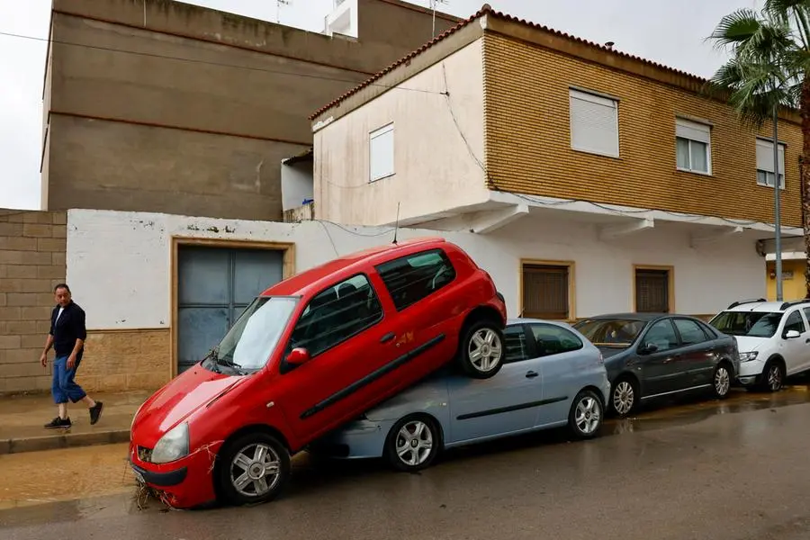 epa11690551 A view shows damaged cars following heavy rains in Llombai, Valencia, Spain, 29 October 2024. The State Meteorological Agency (AEMET) has activated red alerts for rain in various areas of the province of Valencia due to heavy rainfall caused by the storm DANA that is hitting several areas of Spain. EPA/ANA ESCOBAR