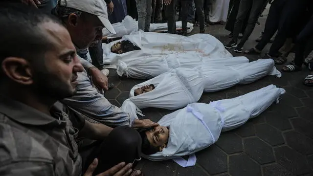 epa11690011 Relatives of Palestinians killed in an Israeli airstrike mourn during their funeral at Al Aqsa Martyrs hospital in Deir Al Balah town, central Gaza Strip, 29 October 2024. According to the Palestinian Ministry of Health in Gaza, at least 10 Palestinians were killed in an Israeli airstrike in the Al Zawaida neighborhood overnight. More than 43,000 Palestinians, including over 13,000 children, have been killed according to the Palestinian Ministry of Health and over 1,400 Israelis have been killed according to the Israel Defense Forces (IDF), since Hamas militants launched an attack against Israel from the Gaza Strip on 07 October 2023, and the Israeli operations in Gaza and the West Bank which followed it. EPA/MOHAMMED SABER ATTENTION EDITORS: GRAPHIC CONTENT