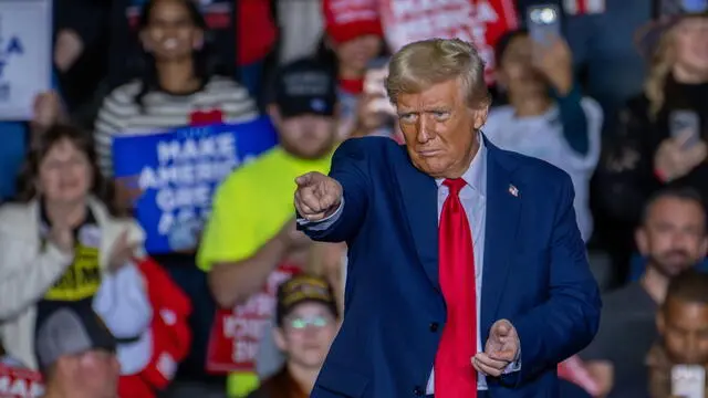 epa11691591 Former US President and Republican Presidential Candidate Donald J. Trump gestures during a campaign rally in Allentown, Pennsylvania, USA, October 29, 2024. Trump is running against Democratic US Vice President Kamala Harris in the presidential election on 05 November 2024. EPA/DAVID MUSE