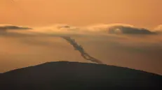 epa11655090 Projectiles are launched from southern Lebanon towards Israel, as seen from an undisclosed location in the Galilee, northern Israel, 11 October 2024. Israel's military stated that around 20 projectiles were identified crossing from Lebanon into Israeli territory in the Upper Galilee area on 11 October. Israeli fighter jets struck 'several Hezbollah launchers' from which rockets were fired toward northern Israel, the statement added. EPA/ATEF SAFADI