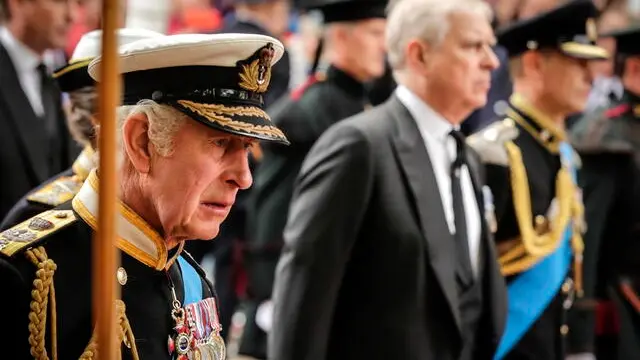 epa10193388 (L-R) Britain's King Charles III, Prince Andrew, Duke of York and Prince Edward, Earl of Wessex follow the coffin of Britain's Queen Elizabeth II as it is carried from Westminster Abbey on its journey to Windsor Castle, during the State Funeral Procession in London, Britain, 19 September 2022. Britain's Queen Elizabeth II died at her Scottish estate, Balmoral Castle, on 08 September 2022. The 96-year-old Queen was the longest-reigning monarch in British history. EPA/OLIVIER HOSLET