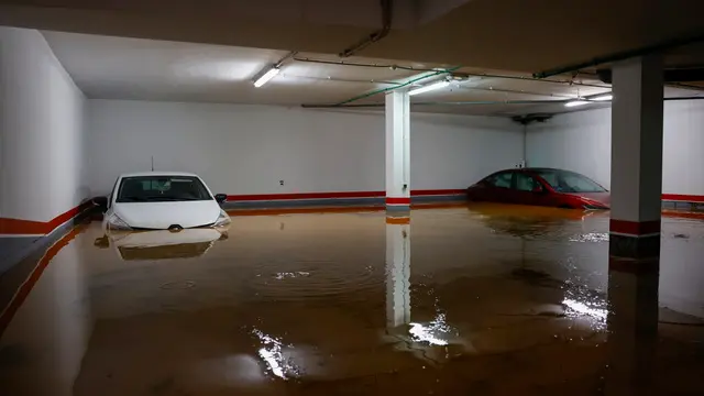 epa11690552 A view shows a flooded parking in Llombai, Valencia, Spain, 29 October 2024. The State Meteorological Agency (AEMET) has activated red alerts for rain in various areas of the province of Valencia due to heavy rainfall caused by the storm DANA that is hitting several areas of Spain. EPA/ANA ESCOBAR