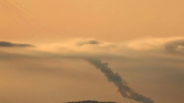 epa11655089 Projectiles are launched from southern Lebanon towards Israel, as seen from an undisclosed location in the Galilee, northern Israel, 11 October 2024. Israel's military stated that around 20 projectiles were identified crossing from Lebanon into Israeli territory in the Upper Galilee area on 11 October. Israeli fighter jets struck 'several Hezbollah launchers' from which rockets were fired toward northern Israel, the statement added. EPA/ATEF SAFADI