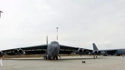 epa11492557 A Romanian TV journalist (L) films a B52 bomber of the US Air Force, during a media event held at Mihail Kogalniceanu NATO air-base at the Black Sea shore, in Romania, 23 July 2024. Two US Air Force B-52H Stratofortress aircraft assigned to the 2nd Bomb Wing, Barksdale Air Force Base, Louisiana, arrived at Mihail Kogalniceanu Airbase, Romania, for Bomber Task Force Europe 24-4, according to a US European Command statement on 21 July. While flying in international airspace and in accordance with international law, the U.S. B-52 aircraft were intercepted by two Russian aircraft over the Barents Sea, but the US aircraft did not change course due to the intercept and continued along their scheduled flight plan without incident before landing in Romania, the statement added. The B-52H Stratofortress is a long-range, heavy bomber that can carry nuclear or precision guided conventional ordnance with worldwide precision delivery, and can perform strategic attack, close-air support, air interdiction, offensive counter-air and maritime operations. EPA/ROBERT GHEMENT