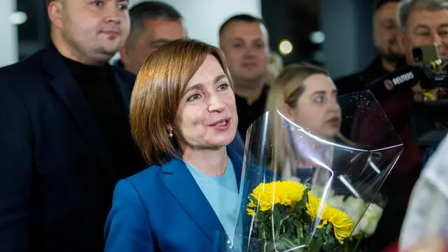 epa11699974 The incumbent President of Moldova Maia Sandu flanked by her supporters following the announcement of the preliminary election results at her campaign headquarters in Chisinau, Moldova, 03 November 2024. Moldova is holding the second round of presidential elections, with former Attorney General of Moldova Alexandr Stoianoglo facing incumbent President of Moldova Maia Sandu. EPA/DUMITRU DORU