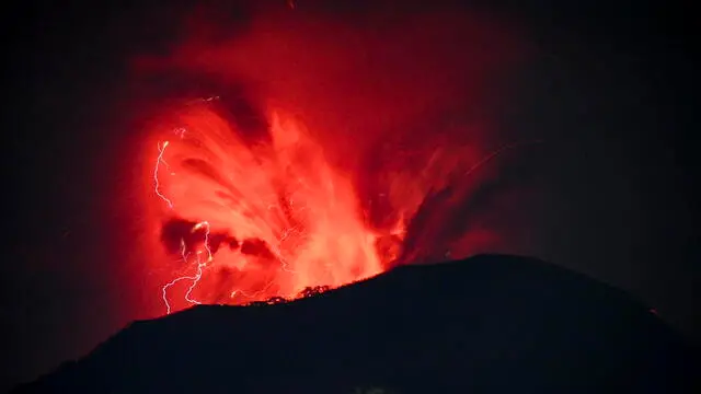 epa11392502 A handout photo made available by the Vulcanology and Geological Disaster Mitigation Center of the Indonesian Ministry of Energy and Mineral Resources (PVMBG) shows Mount Ibu volcano spewing volcanic materials during an eruption in West Halmahera, North Maluku, Indonesia, 06 June 2024. The volcano erupted twice on 06 June 2024, releasing volcanic clouds and red lava up into the air during the eruptions. Mount Ibu remains on the highest alert level according to PVMBG officials. EPA/PVMBG / HANDOUT HANDOUT, EDITORIAL USE ONLY, NO SALES, BEST QUALITY AVAILABLE HANDOUT EDITORIAL USE ONLY/NO SALES HANDOUT EDITORIAL USE ONLY/NO SALES