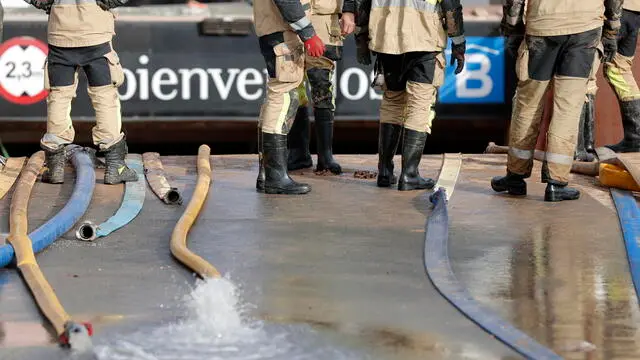 epa11698482 Firefighters pump out water from a flooded underground parking garage at Bonaire mall in Valencia, eastern Spain 03 November 2024. Rains have left more than 200 dead, an undetermined number of missing people, and widespread damage, especially in the province of Valencia. Thousands of volunteers are helping in a day that culminates in the largest deployment of military and security forces personnel in peacetime, according to the Spanish prime minister. EPA/Manuel Bruque