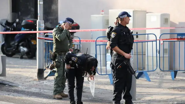 epa11486768 Police inspect the damage at the scene of an explosion possibly caused by an unmanned aerial vehicle (UAV), in Tel Aviv, Israel, 19 July 2024. According to a statement by the Israeli Defense Forces (IDF), one person was killed and eight others injured in the explosion, which was caused by 'a falling aerial target.' The explosion occured around 50 meters (164 feet) from the US Embassy in Tel Aviv. EPA/ABIR SULTAN