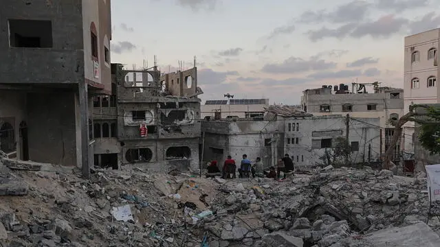 epa10718219 A Palestinian family sits among the rubble of their houses, destroyed during Israel and Islamic Jihad fighting in Beit Lahiya town, northern Gaza Strip, 29 June 2023. EPA/MOHAMMED SABER