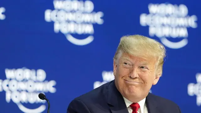 epa08146822 US President Donald J. Trump smiles before addressing a plenary session during the 50th annual meeting of the World Economic Forum (WEF) in Davos, Switzerland, 21 January 2020. The meeting brings together entrepreneurs, scientists, corporate and political leaders in Davos under the topic 'Stakeholders for a Cohesive and Sustainable World' from 21 to 24 January 2020. EPA/GIAN EHRENZELLER