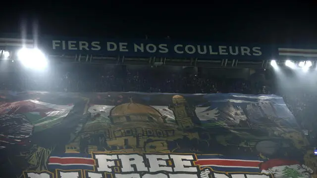 epa11705922 Supporters of Paris Saint Germain display a banner reading 'Free Palestine' during the UEFA Champions League league phase match between Paris Saint-Germain and Atletico Madrid, in Paris, France, 06 November 2024. EPA/YOAN VALAT