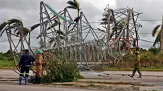 epa11708996 Workers observe a fallen power tower after the passage of Hurricane Rafael in Artemisa, Cuba, 07 November 2024. The Cuban government has already indicated, shortly after Rafael passed, that the impacts concentrated in the western regions of Havana, Artemisa, and Mayabeque are 'powerful.' So far, no fatalities have been reported, as emphasized on social media by the Cuban Foreign Minister, Bruno Rodriguez. EPA/Ernesto Mastrascusa