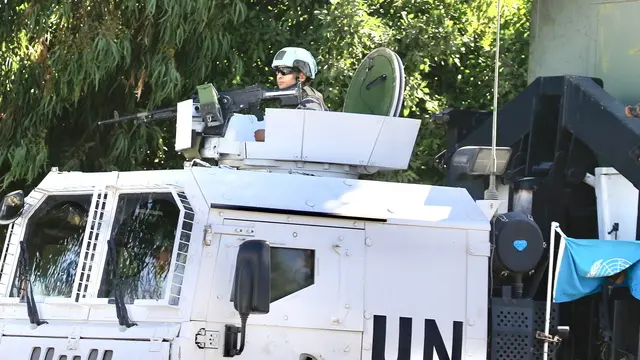 epa11680312 UNIFIL peacekeepers patrol near a Lebanese army checkpoint in Borj Rahal town, in the Tyre District, southern Lebanon, 24 October 2024. According to the Lebanese Ministry of Health, more than 2,500 people have been killed and over 12,000 others have been injured in Lebanon since the start of recent escalations of hostilities. EPA/STRINGER