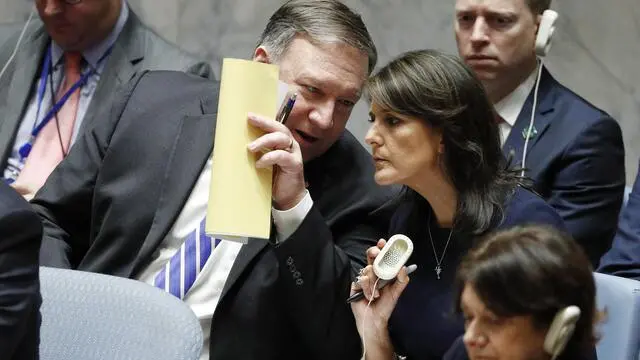 epa07048526 US Secretary of State Mike Pompeo (L) talks with US Ambassador to the UN Nikki Haley (R) as he chairs the United Nations Security Council meeting on the sidelines of the General Debate of the General Assembly of the United Nations at United Nations Headquarters in New York, New York, USA, 26 September 2018. The General Debate of the 73rd session began on 25 September 2018. EPA/JUSTIN LANE