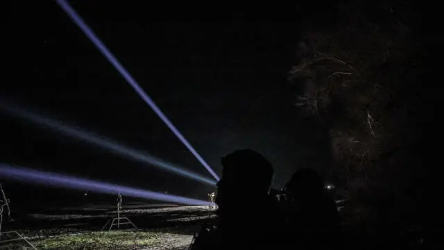 epa11049417 Ukrainian servicemen of the 241st Brigade of Territorial Defense operate search lights after an air raid alarm in the Kyiv region, Ukraine, 29 December 2023. At least 18 people have died and over 130 were injured after Russia launched a wave of airstrikes across Ukraine, Ukraine's Ministry of Internal Affairs said on 29 December. Strikes were reported in Kyiv, Lviv, Odesa, Dnipro, Kharkiv, Zaporizhzhia, and other Ukrainian cities. Russia launched 'more than 150 missiles and combat drones' at Ukrainian cities, Ukraine's Prosecutor General Andriy Kostin said in a statement, adding that extensive damage included residential buildings, educational institutions and hospitals. Russian troops entered Ukrainian territory on 24 February 2022, starting a conflict that has provoked destruction and a humanitarian crisis. EPA/Oleg Petrasyuk