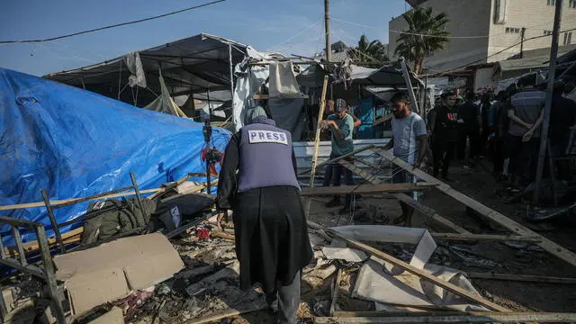 epa11711578 A Palestinian journalist inspects damaged shelters following an Israeli airstrike inside the Al Aqsa Martyrs Hospital compound in Deir Al Balah, central Gaza Strip, 09 November 2024. According to the Palestinian Ministry of Health in Gaza, at least two people were killed and more than 27 others were wounded. More than 43,500 Palestinians, including over 13,000 children, have been killed according to the Palestinian Ministry of Health, and over 1,400 Israelis have been killed according to the Israel Defense Forces (IDF), since Hamas militants launched an attack against Israel from the Gaza Strip on 07 October 2023, and the Israeli operations in Gaza and the West Bank which followed it. EPA/MOHAMMED SABER